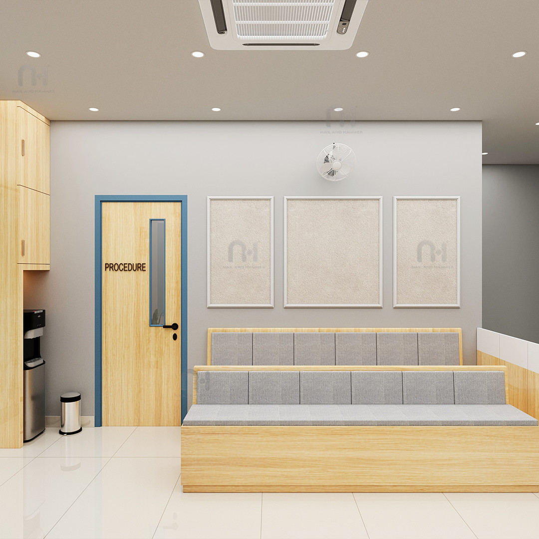 Dashwant Health Care waiting area with wooden bench seating and procedure room entrance