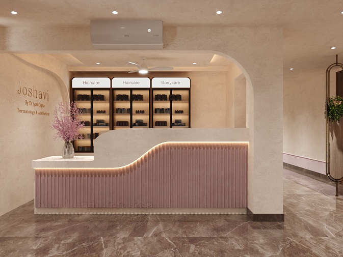 Joshavi clinic reception counter with fluted blush pink panels, LED lighting and backlit haircare and bodycare retail shelves