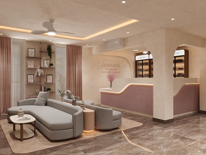Dermatology clinic interior design at Joshavi Clinic – wide view of reception and lounge with curved sofas, blush pink fluted counter and arched display